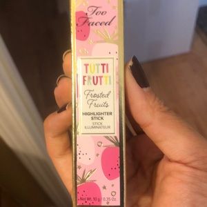 Too Faced highlighter stick.